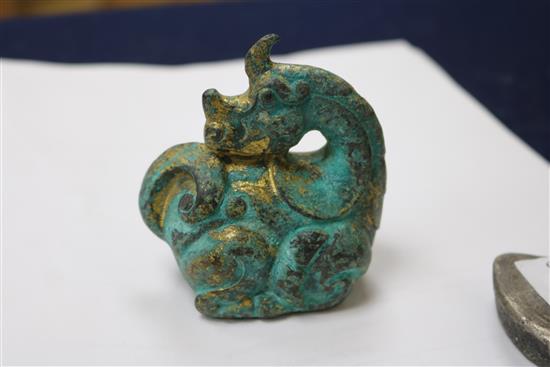 A Chinese ingot? 7cm and a gilt bronze dragon, 7.5cm.